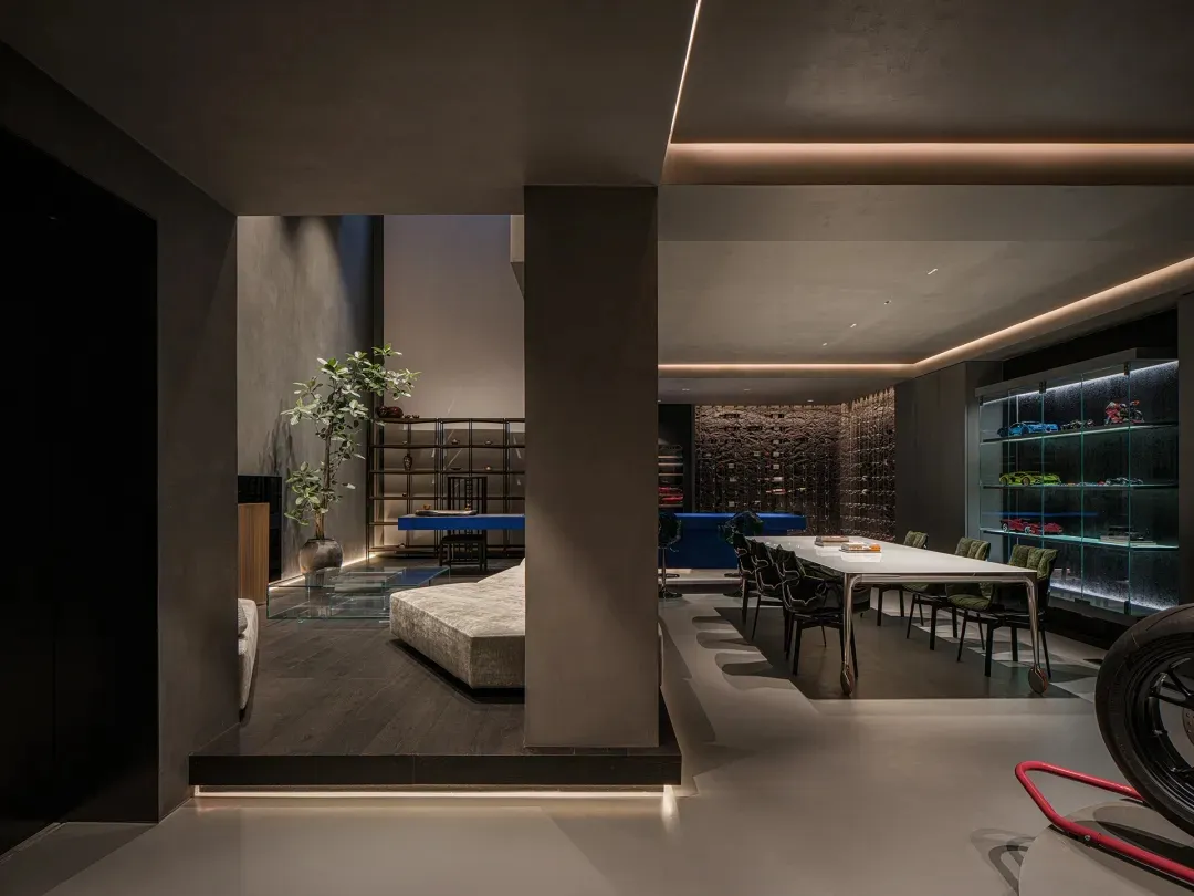 Interior design featuring modern living space with concrete elements and minimalist furniture layout.