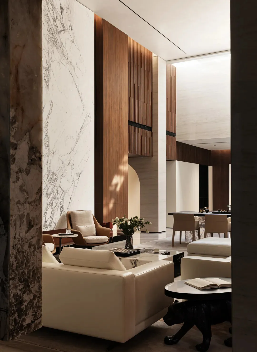 Modern interior design featuring marble walls and wooden accents.