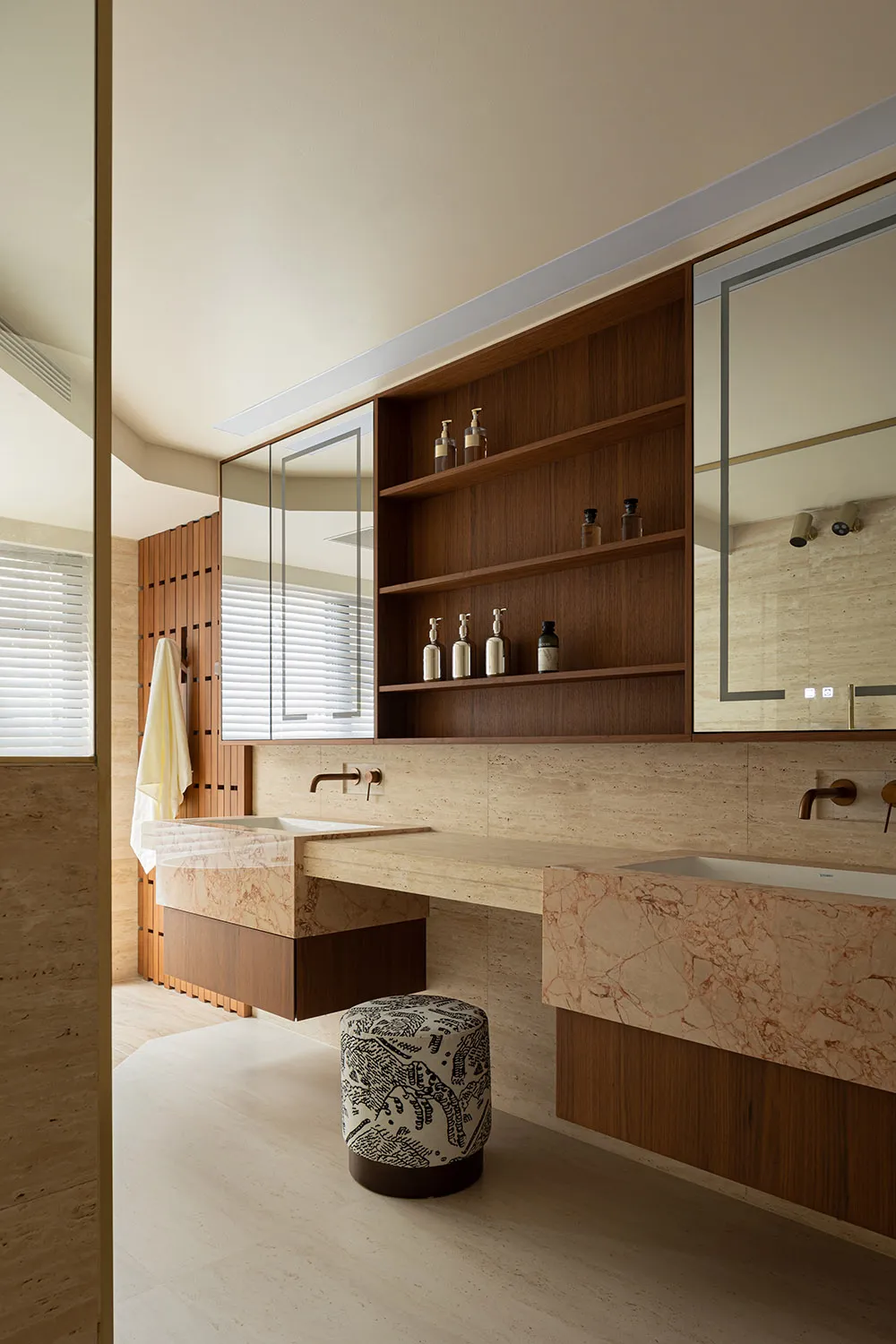 Modern minimalist bathroom designed with marble finishes and contemporary fixtures.
