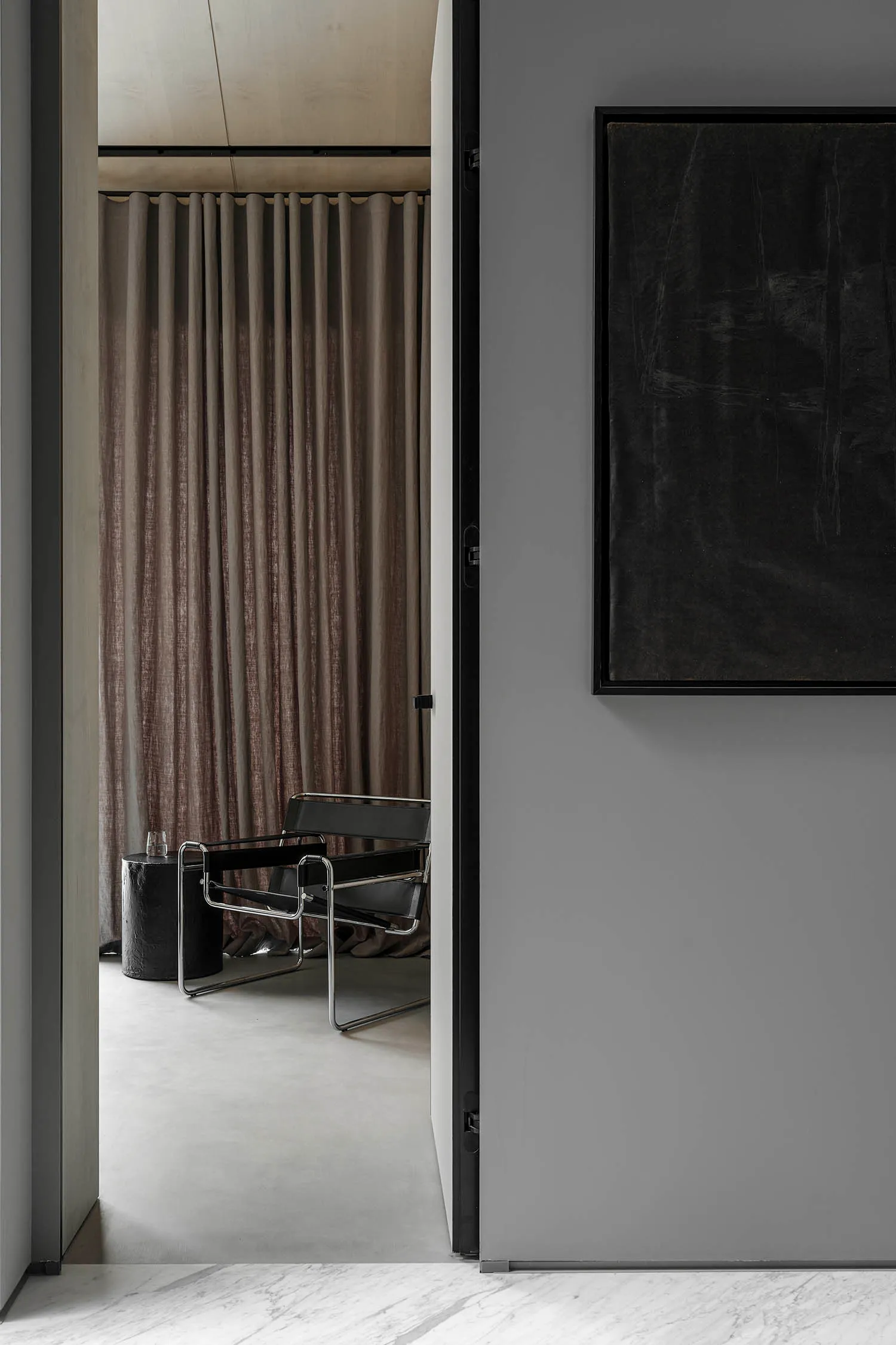 Modern interior design with black furniture and lighting