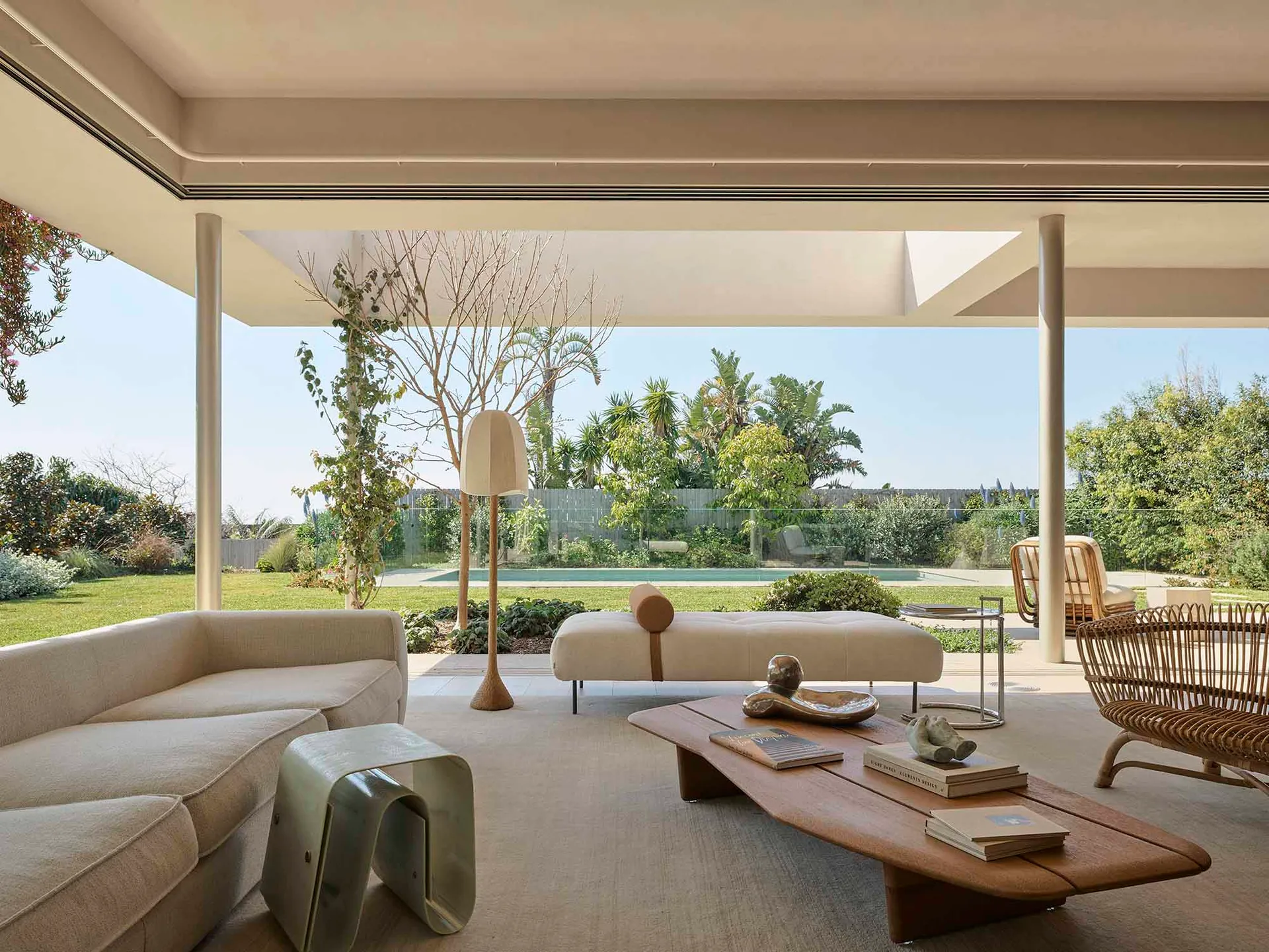 Modern living room featuring concrete, glass, and wood materials.
