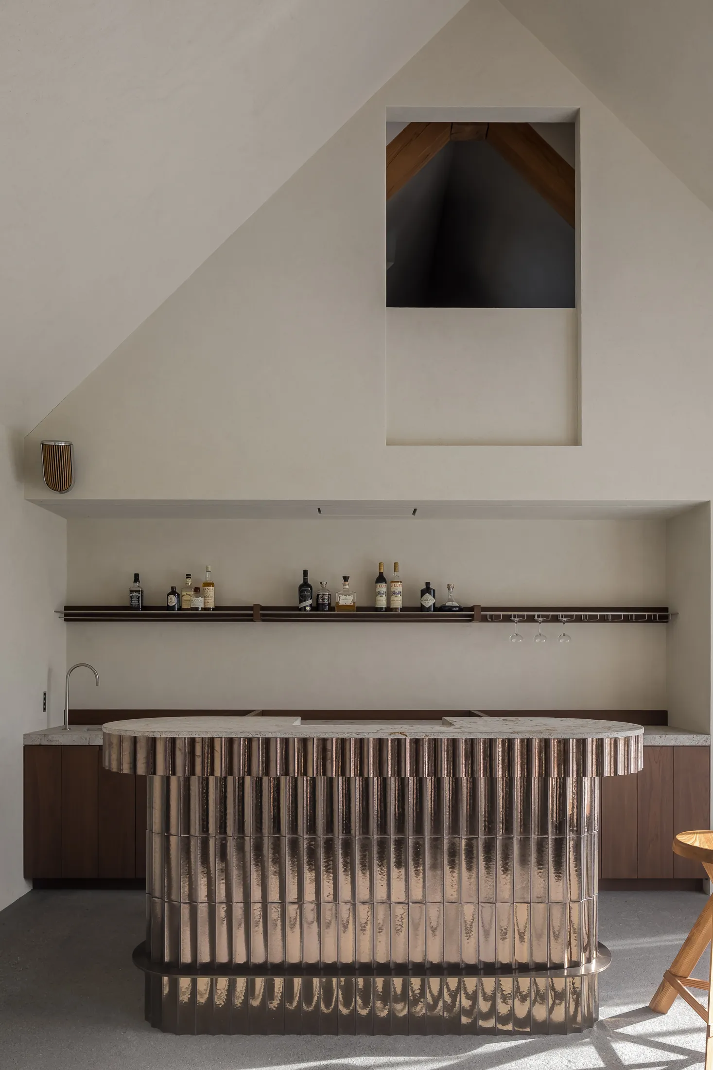 Modern minimalist kitchen featuring a metallic countertop and shelves.