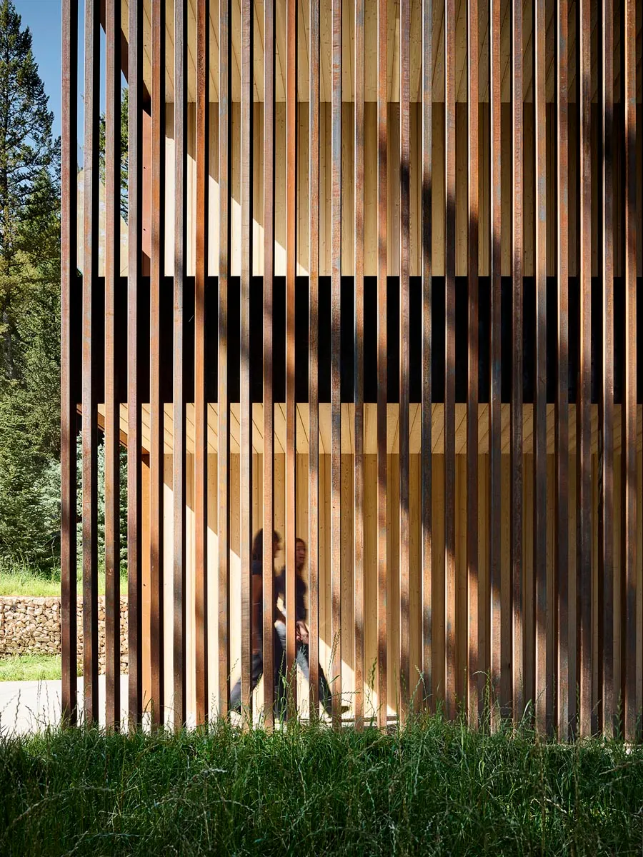 A modern building facade featuring vertical wooden slats.