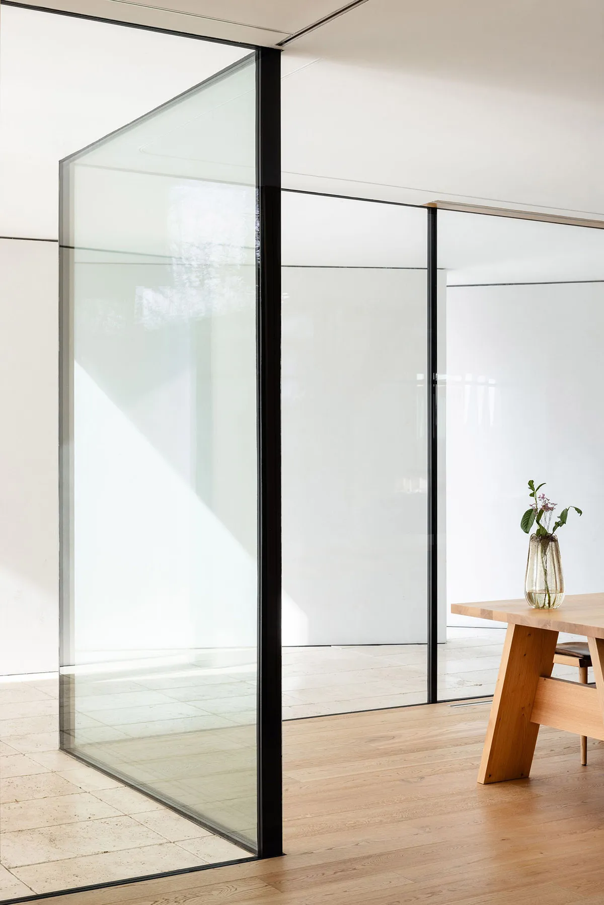 Modern interior with glass walls and wooden furniture