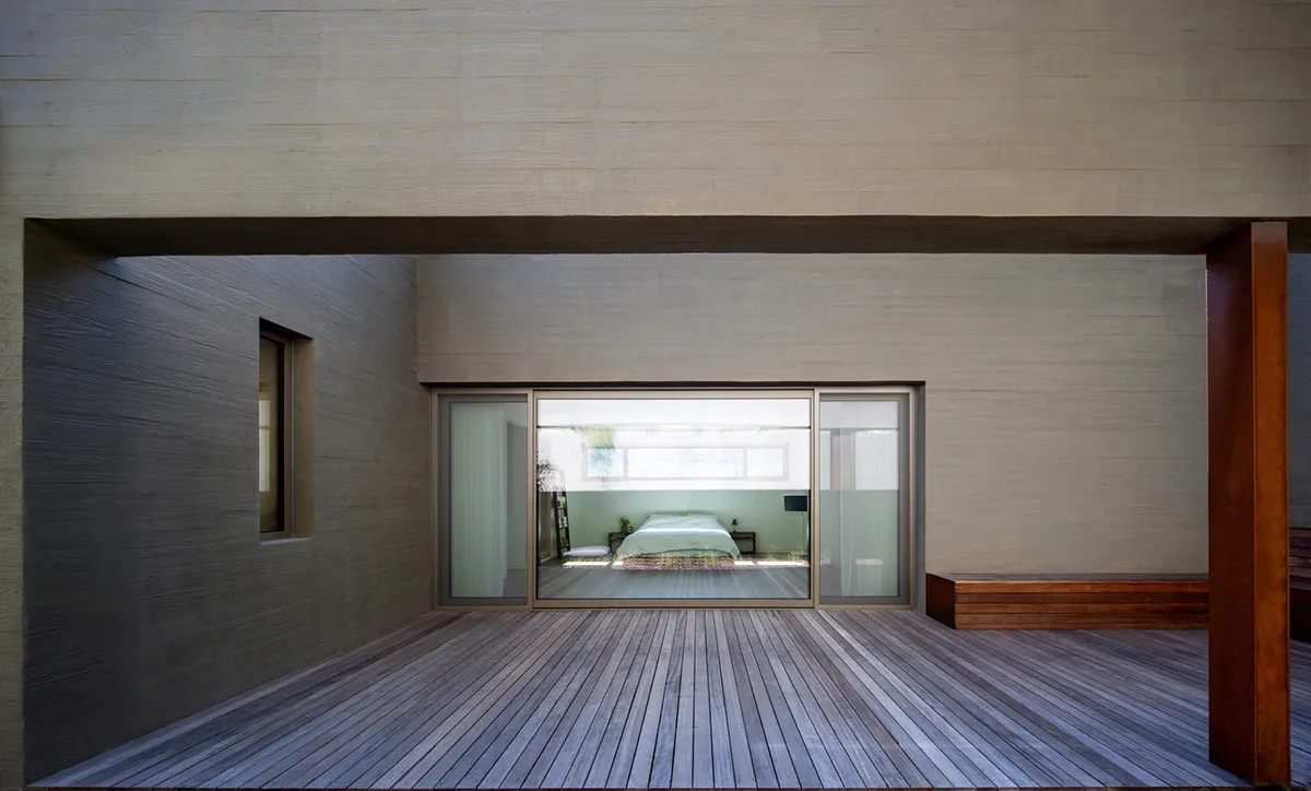 Modern minimalist residential interior designed with natural wood and metal accents.