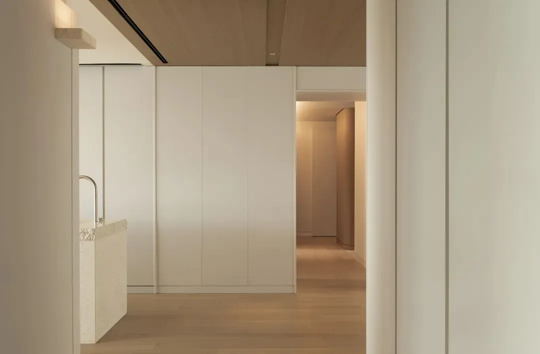 Modern interior featuring a floor with terrazzo material