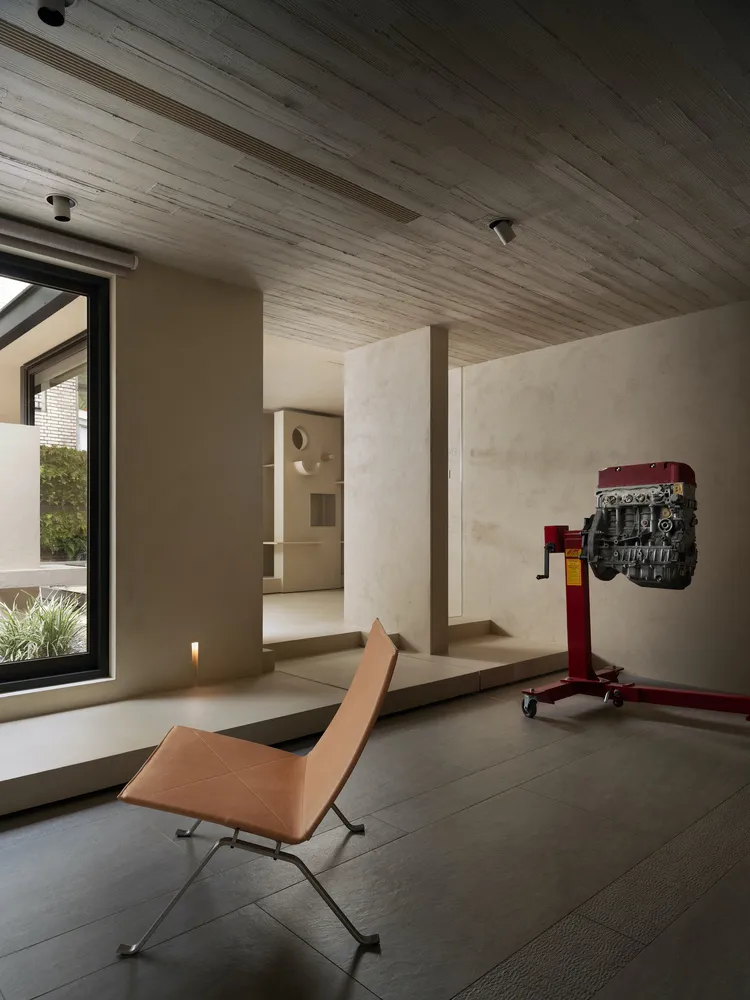 A minimalist space featuring concrete materials and a sleek, modern design.