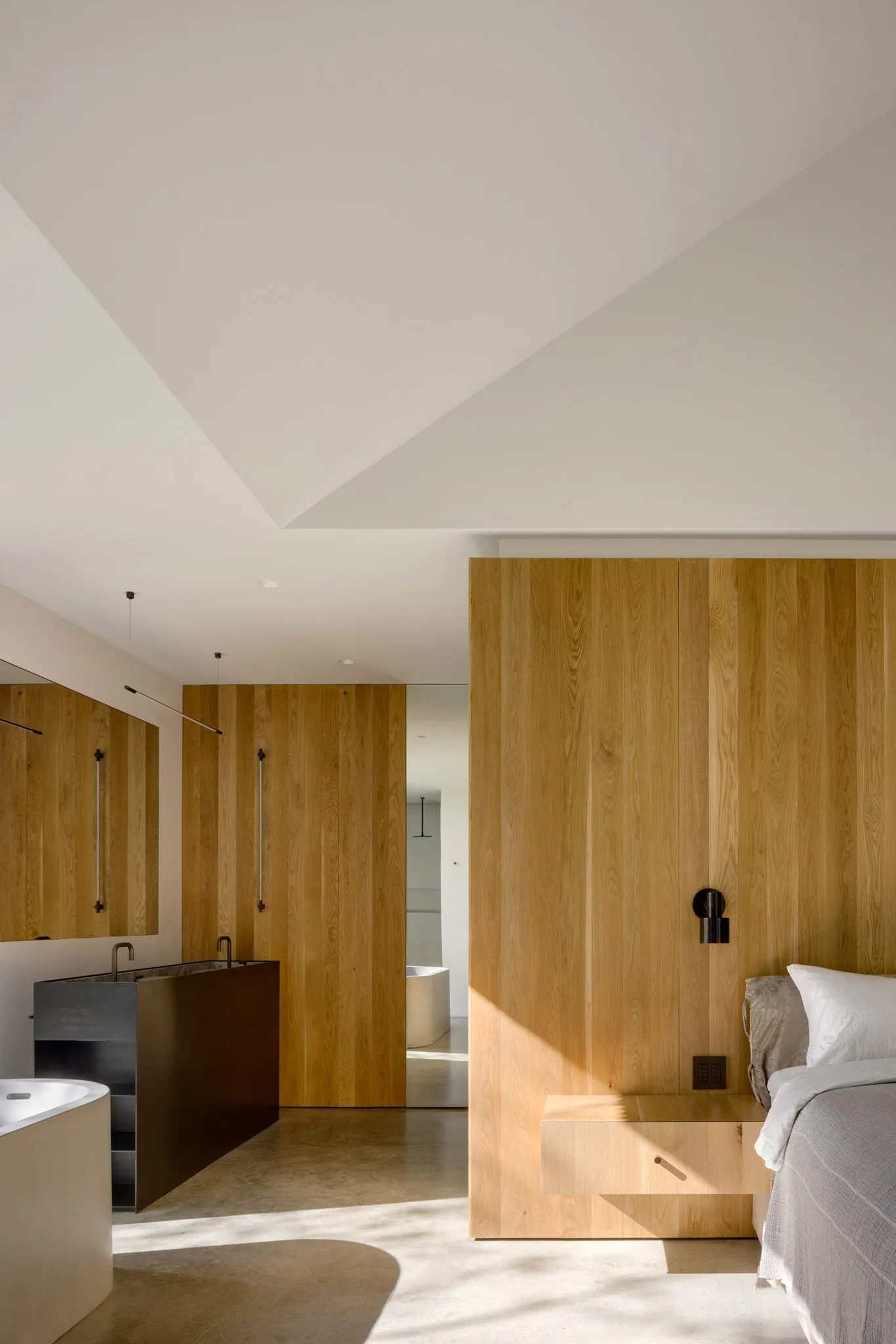 Modern bedroom featuring wood paneling and minimalist design