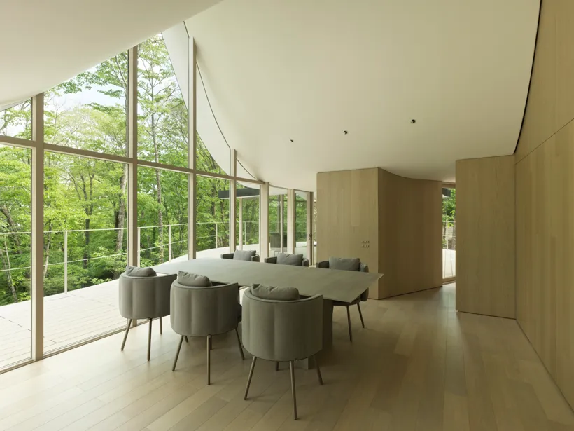 Modern residential interior featuring wood and glass materials.