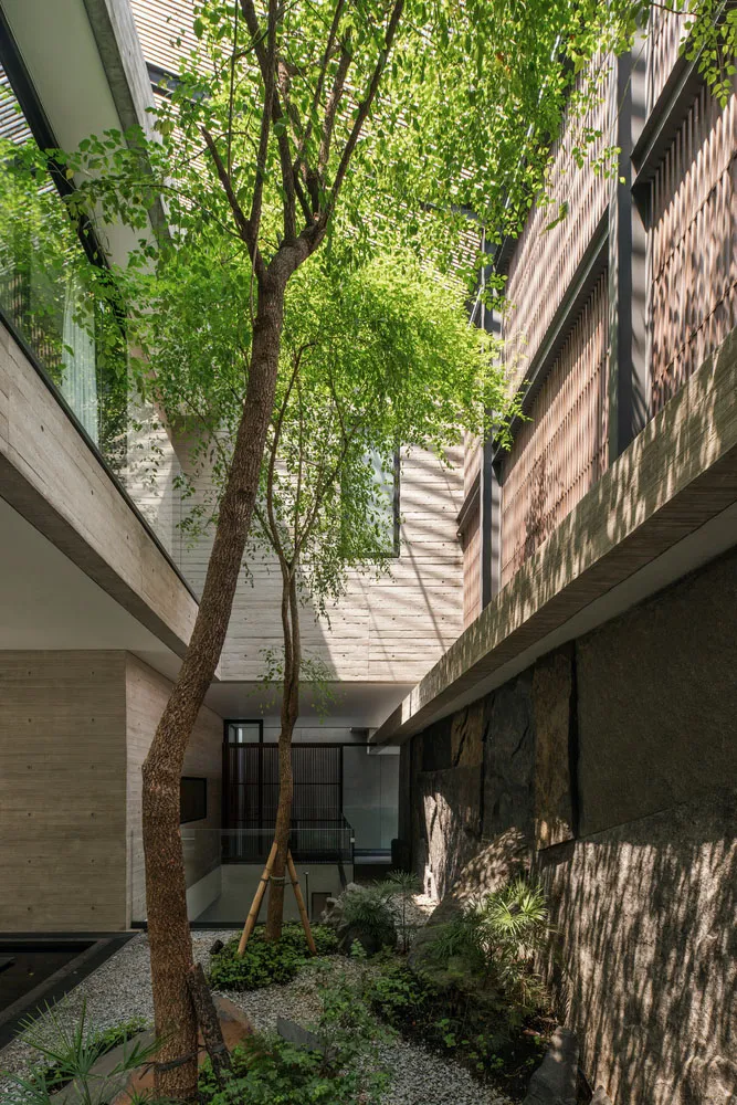 An urban garden featuring concrete and stone elements