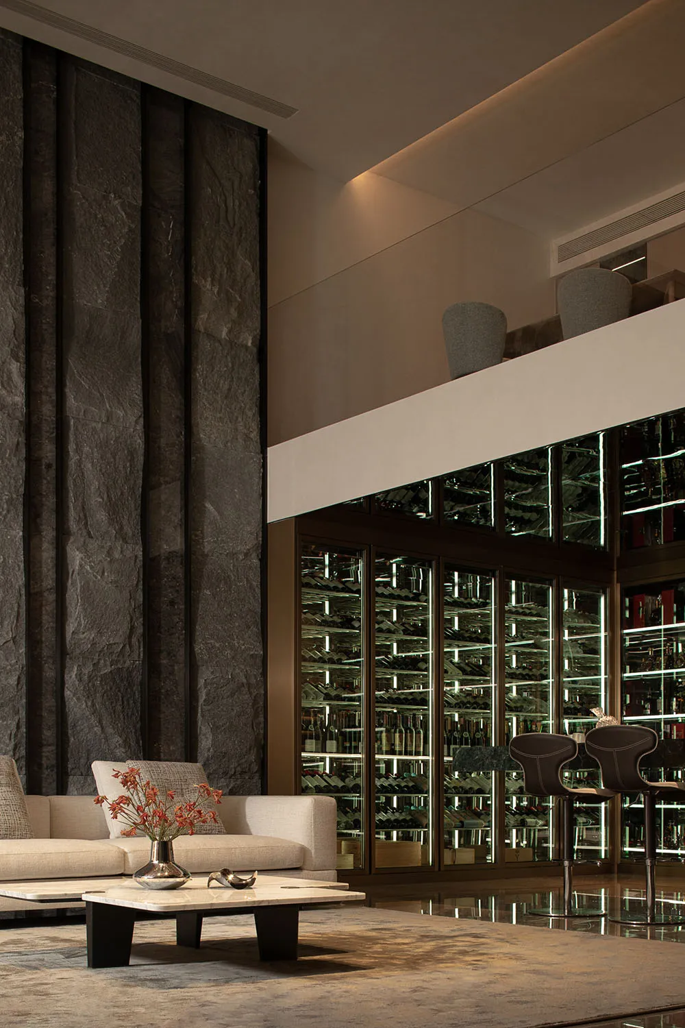 Modern interior design with marble, concrete, and wooden elements, featuring a luxurious lobby and a wine cellar.