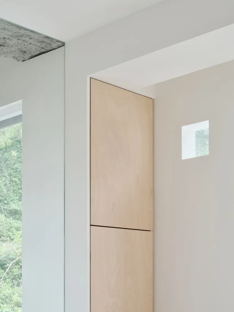 Modern minimalist interior space with clean lines and wooden paneling