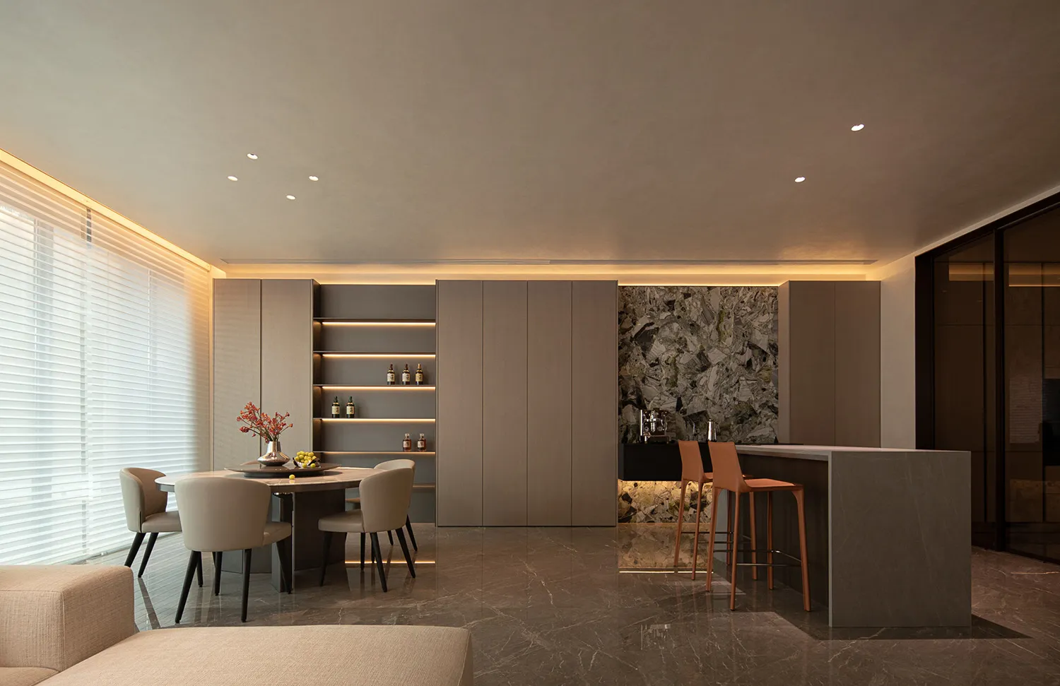 High-quality photograph of a modern residential kitchen featuring stone countertops and wood cabinets.