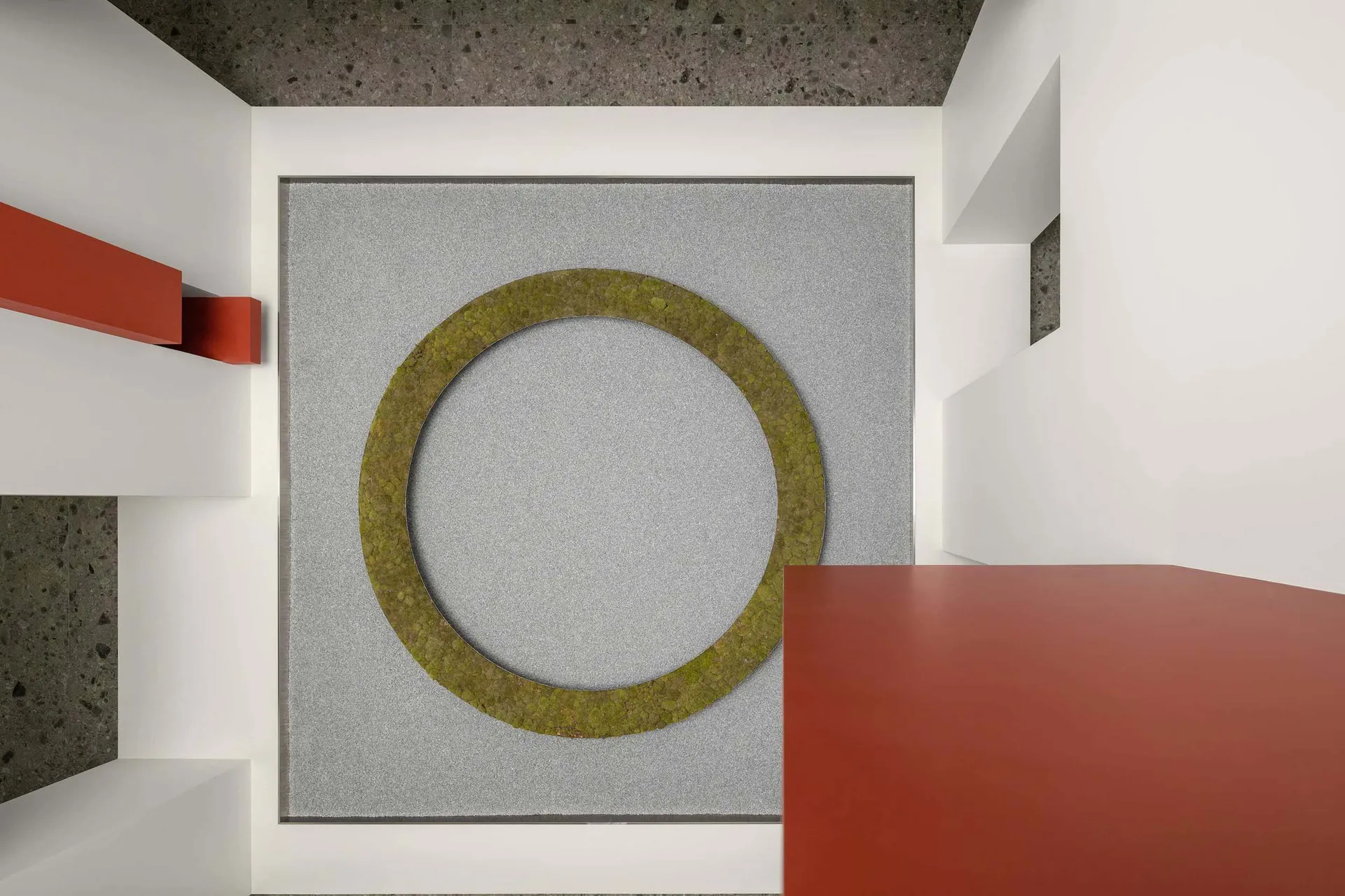 A modern interior floor plan featuring a circular concrete design element.