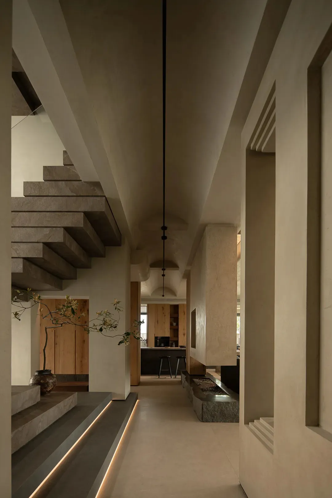 Concrete stairs and walls in a minimalist residential interior