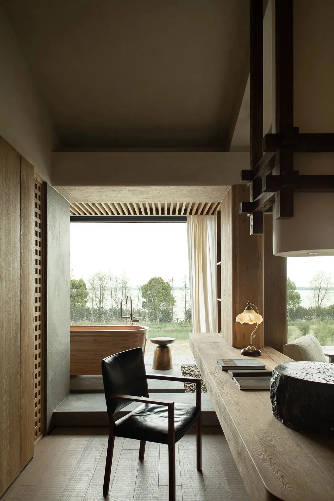 A modern residential interior featuring minimalist design, wood materials, and a serene atmosphere.