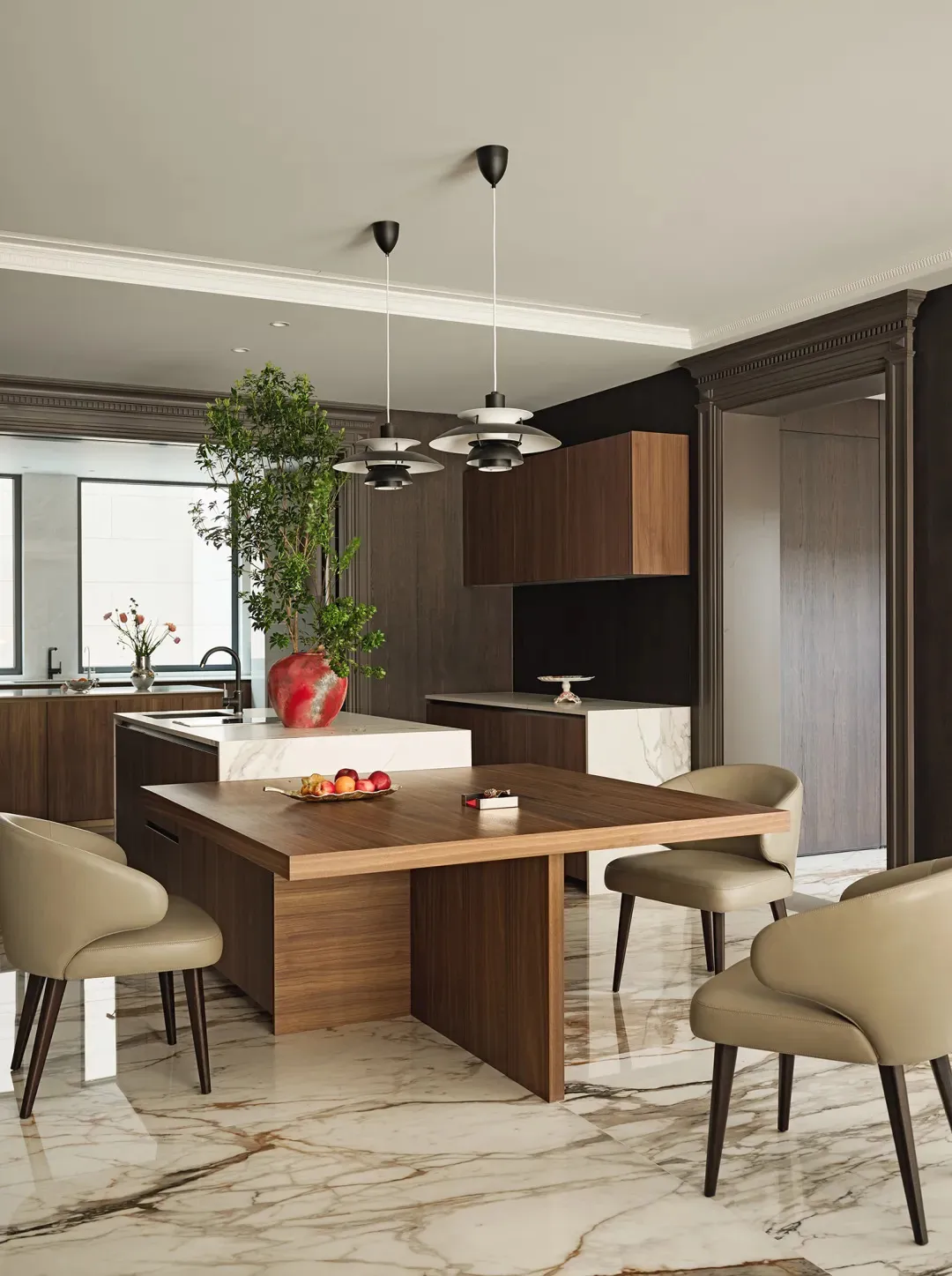 Contemporary kitchen with marble countertops, wooden cabinets, and glass pendant lights.