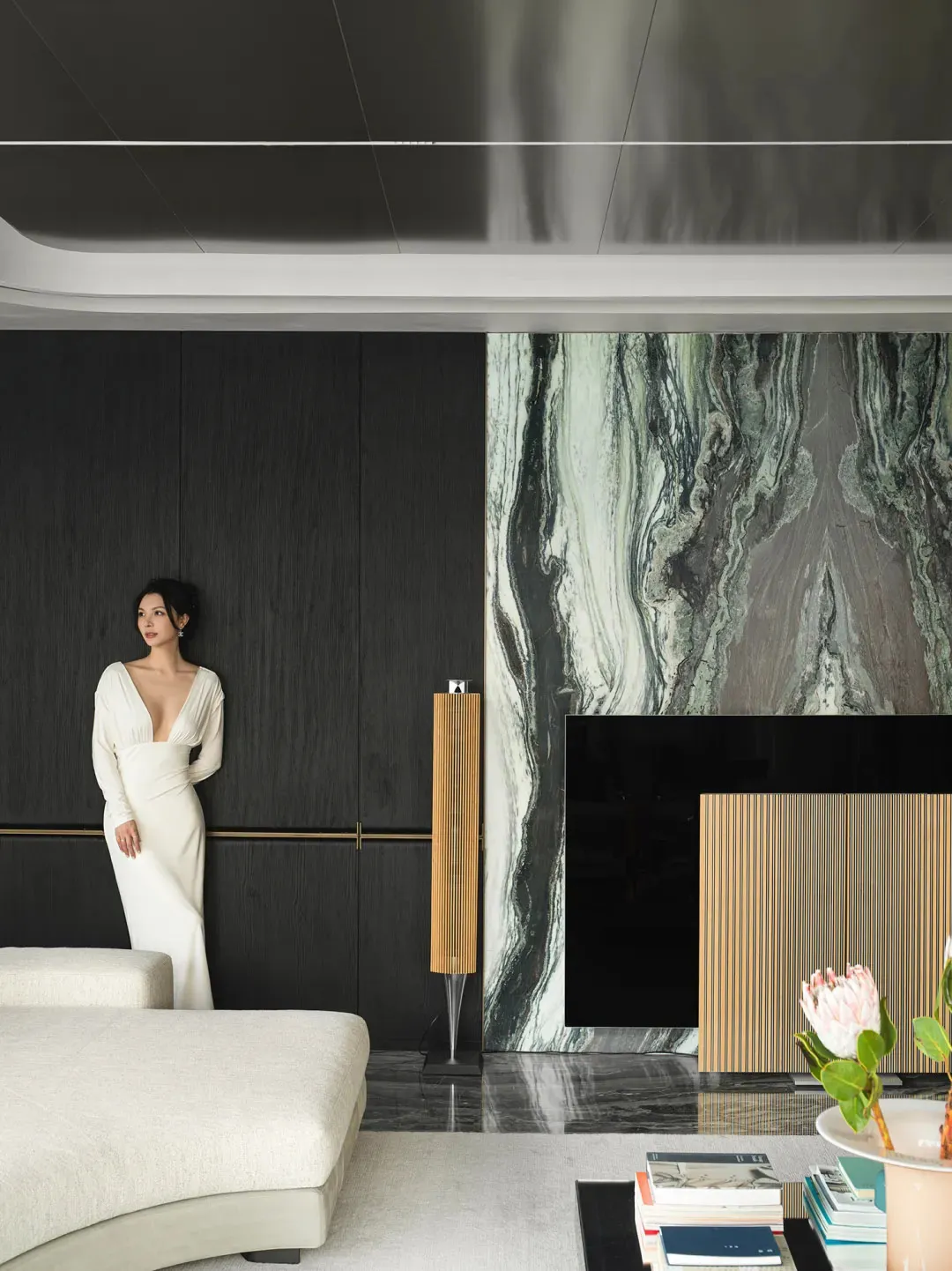 Modern interior design featuring sleek, minimalist furniture and marble accents.