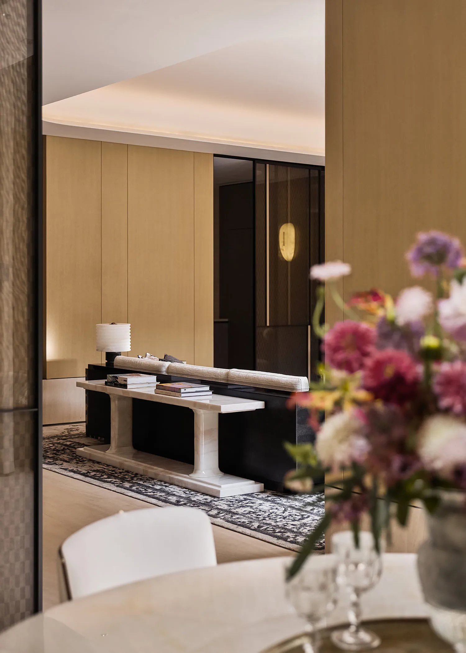 Modern living room with marble furniture and decorative flowers