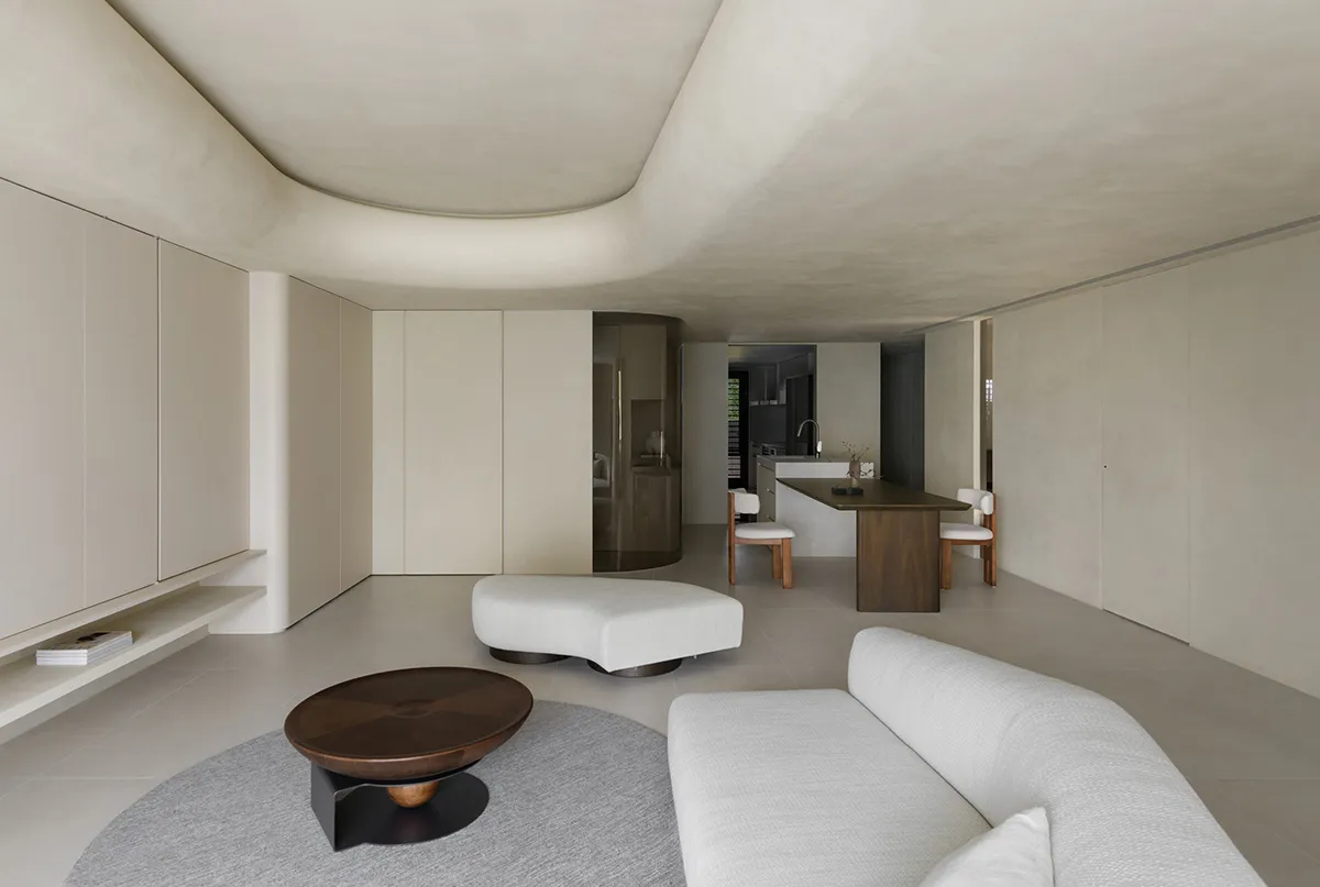 A modern minimalist living room with neutral-tones and clean lines.