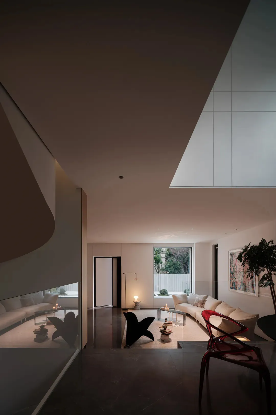Modern minimalist living room featuring concrete furniture and floor.