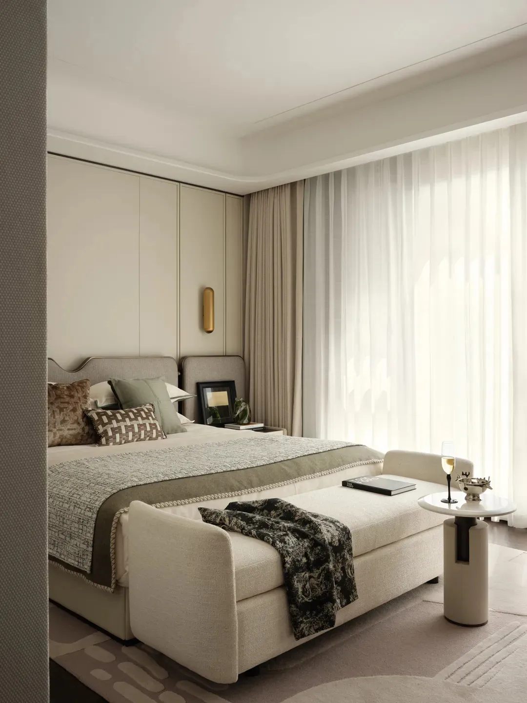 Minimalist bedroom featuring modern furniture and neutral color palette.