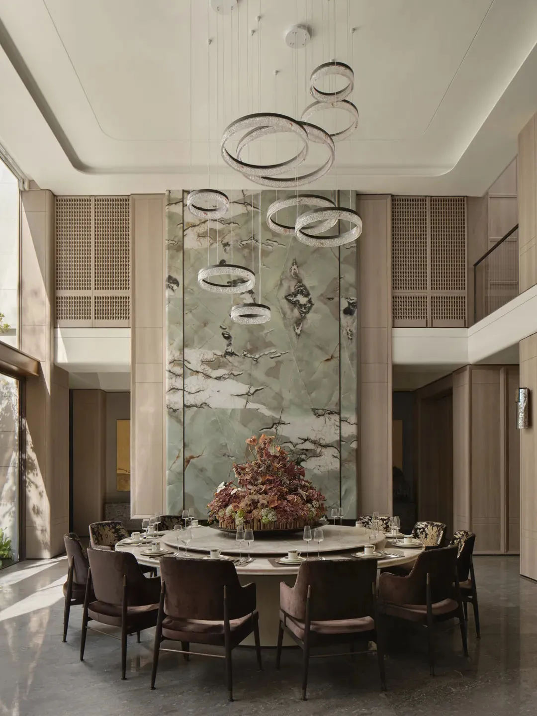 Modern dining room featuring marble and concrete elements