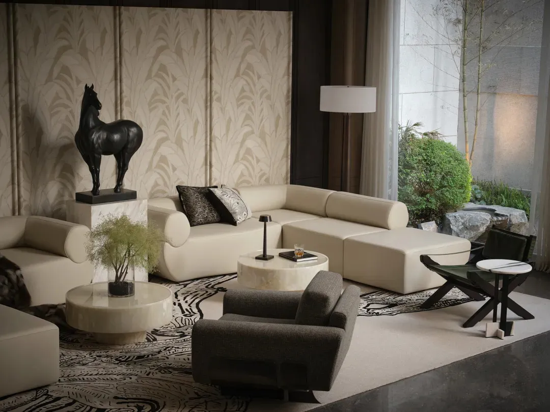 A luxurious living room featuring minimalist, contemporary design with white leather furniture and sophisticated decor.