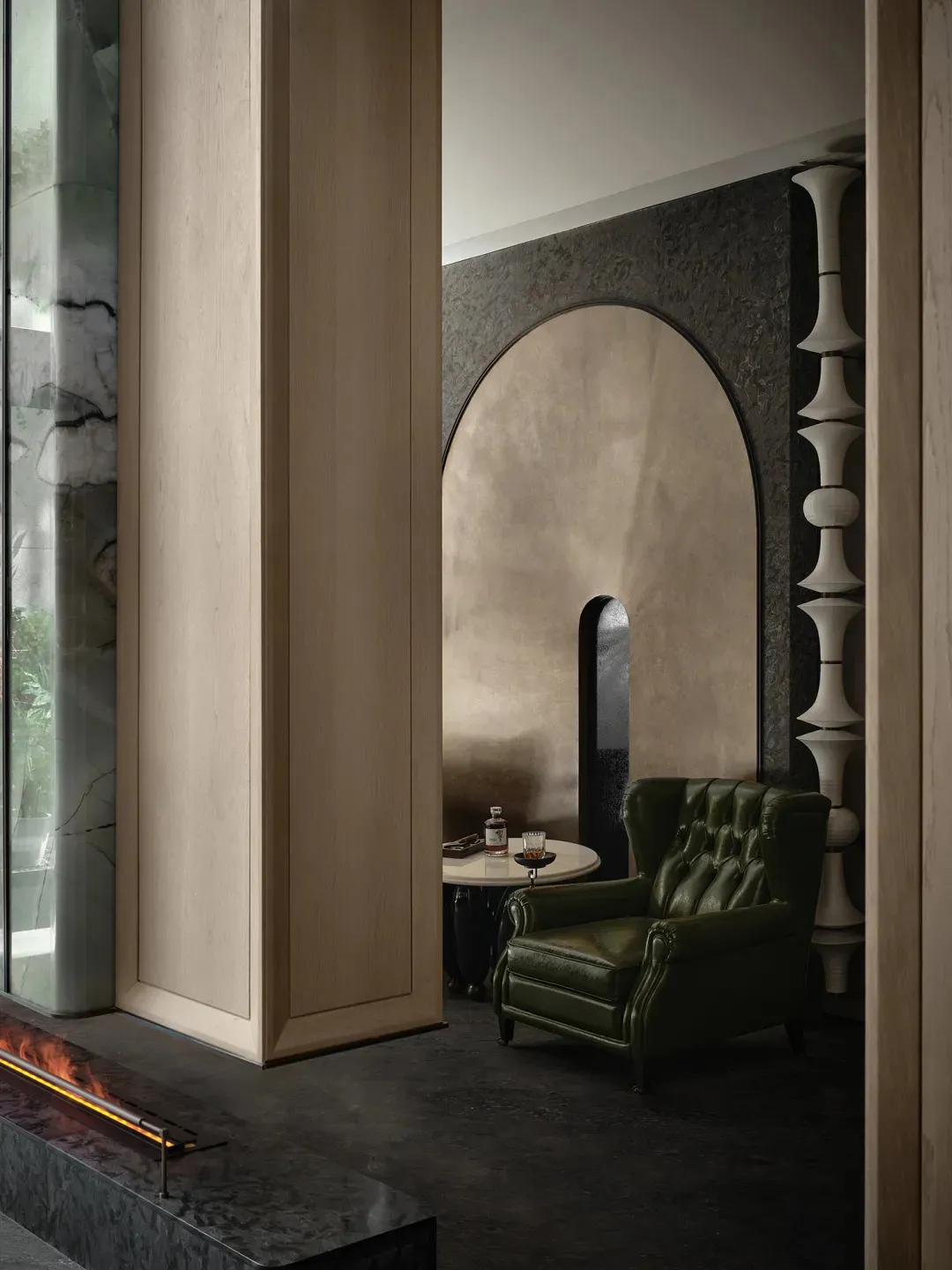 Modern living room featuring textured concrete walls and marble accents.