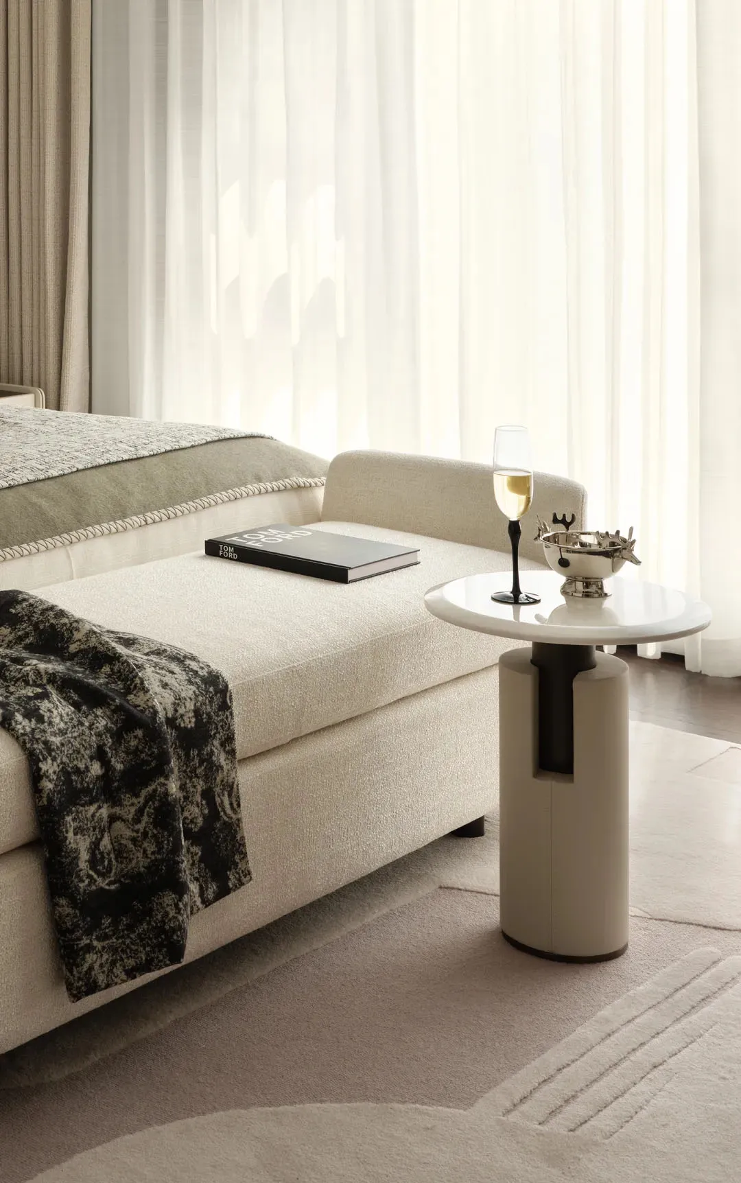 A modern minimalist bedroom with white furniture and floor-to-ceiling curtains.