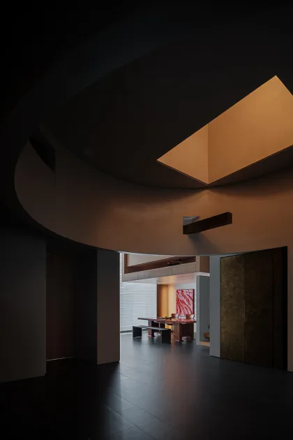Modern office suite featuring wooden floors, glass partitions, and metallic accents.