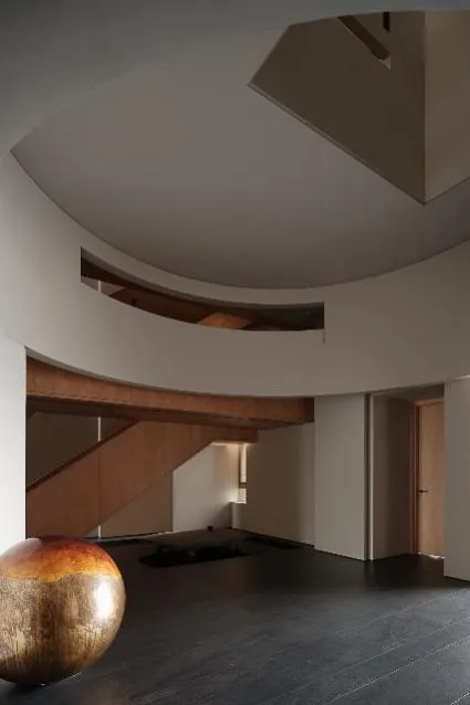 Modern residential interior featuring a sleek, open-concept staircase with timber elements.