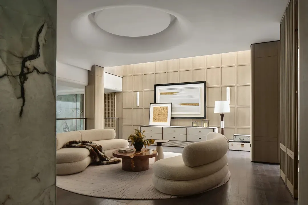 Modern minimalist living room with neutral color palette and stylish decor.