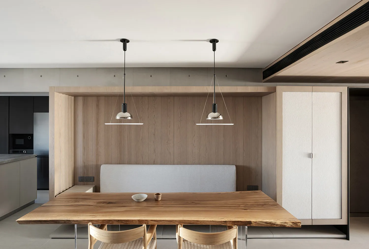 Contemporary minimalist living space with wooden furniture, featuring a sleek, modern design and clean lines.