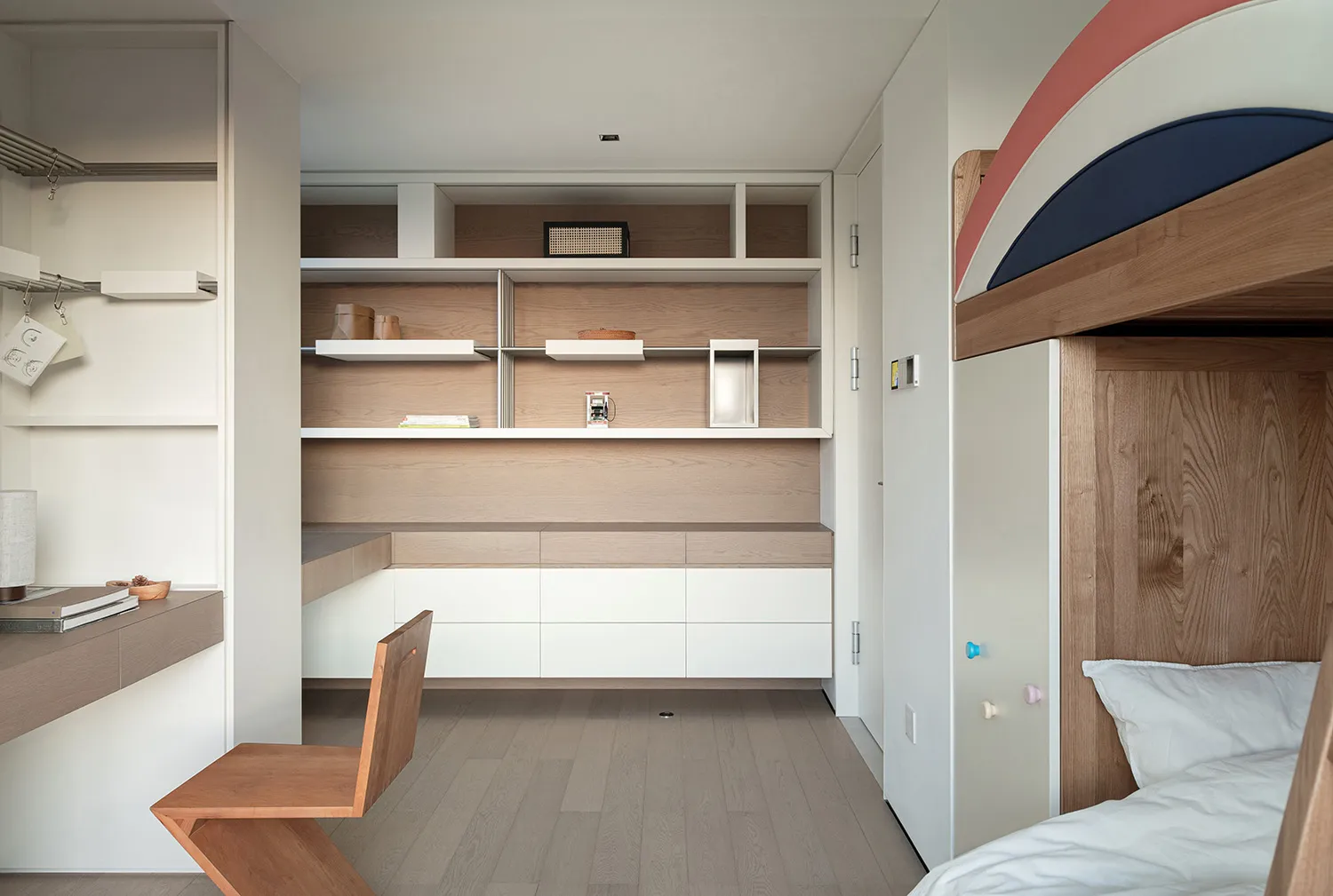 Modern minimalist bedroom featuring wooden furniture and white accents.
