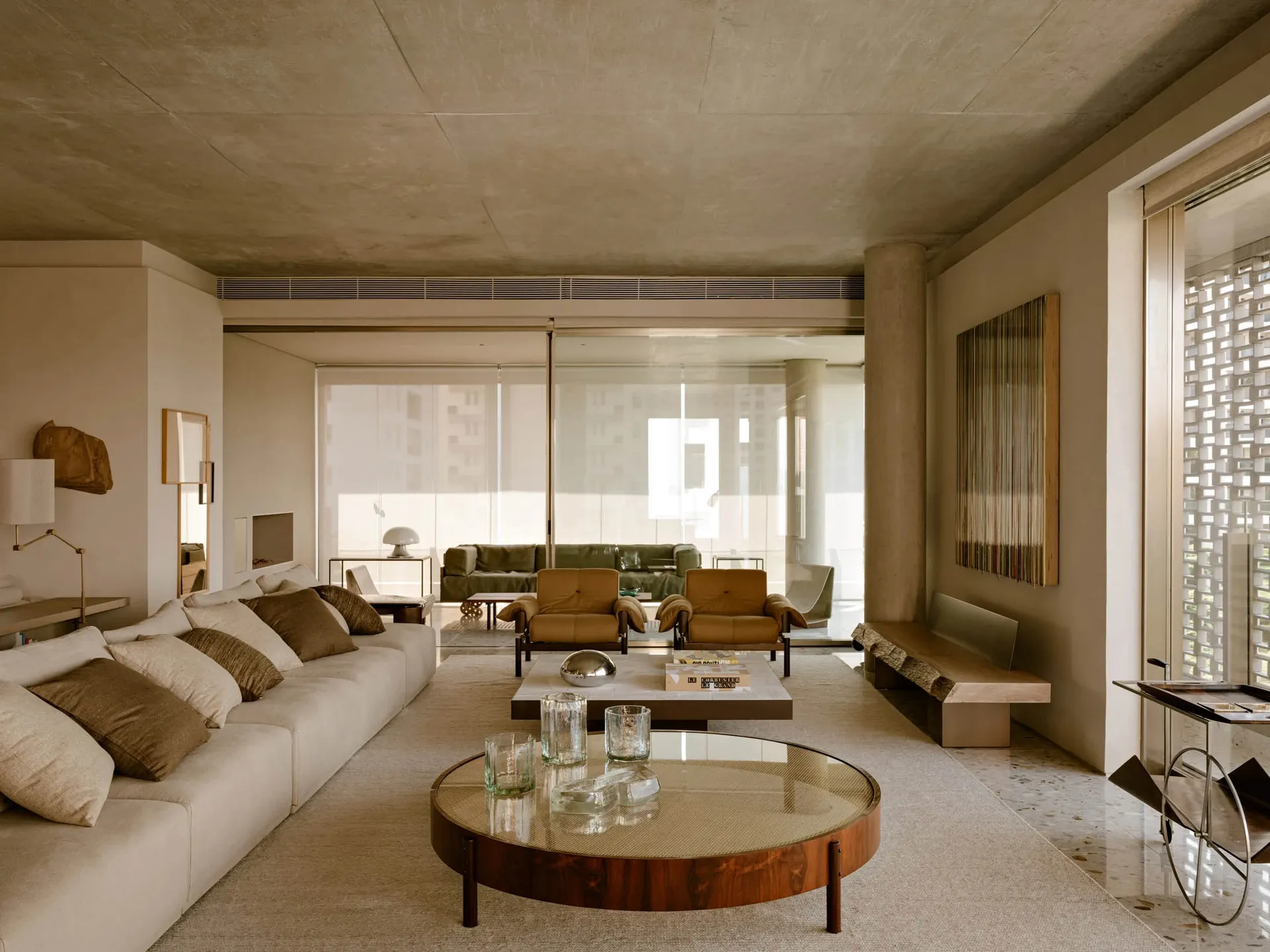 A modern living room featuring concrete materials and minimalist design.