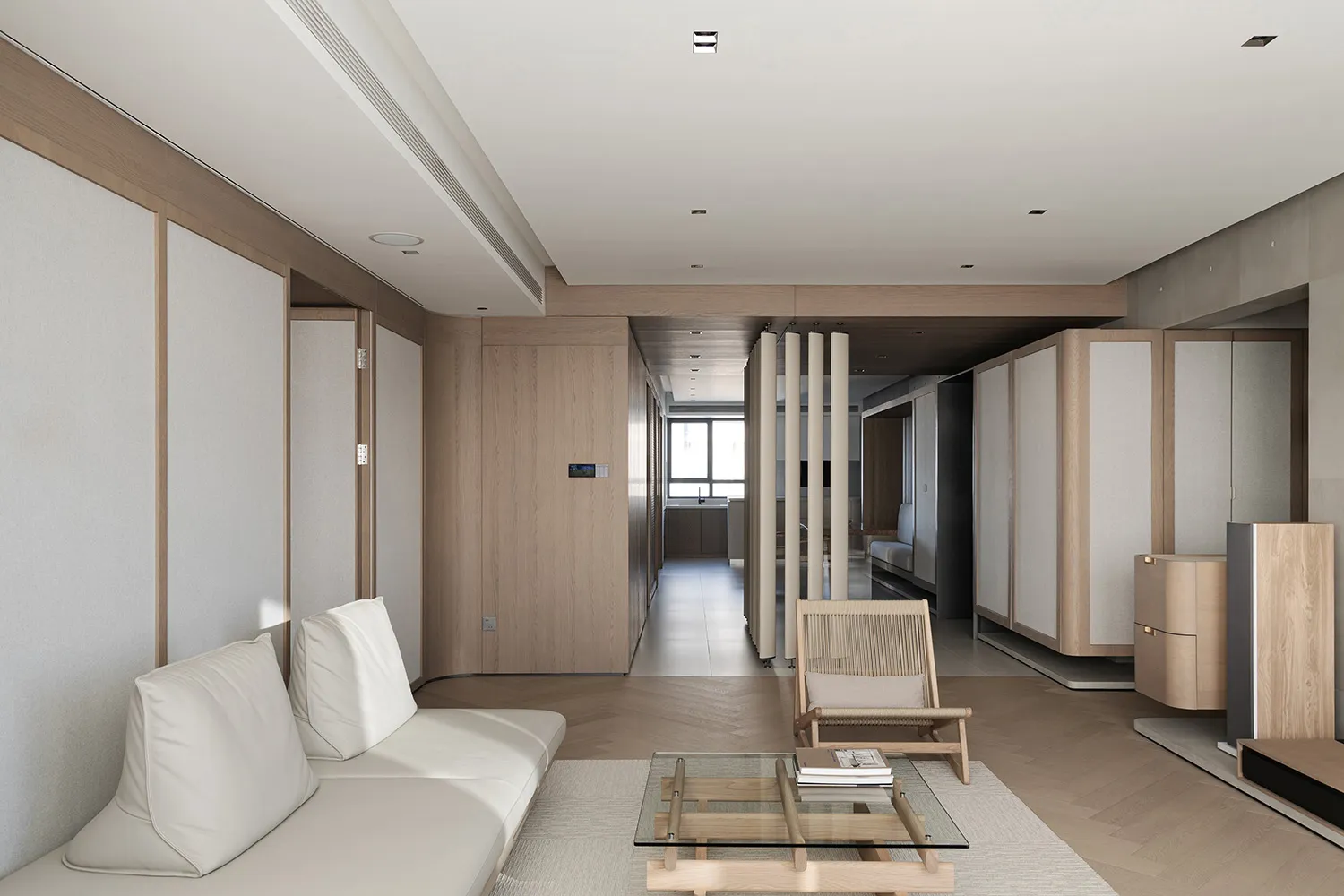 A sleek, minimalist living room featuring modern, white couches, a glass coffee table, and wooden accents.