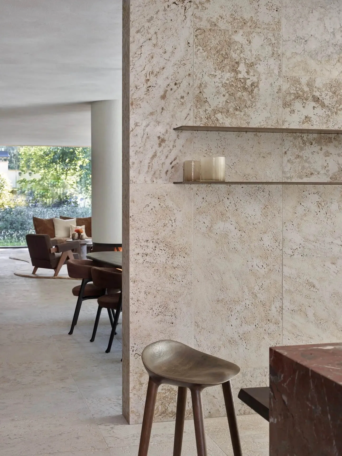 A modern cafe featuring a stone countertop and minimalist decor.