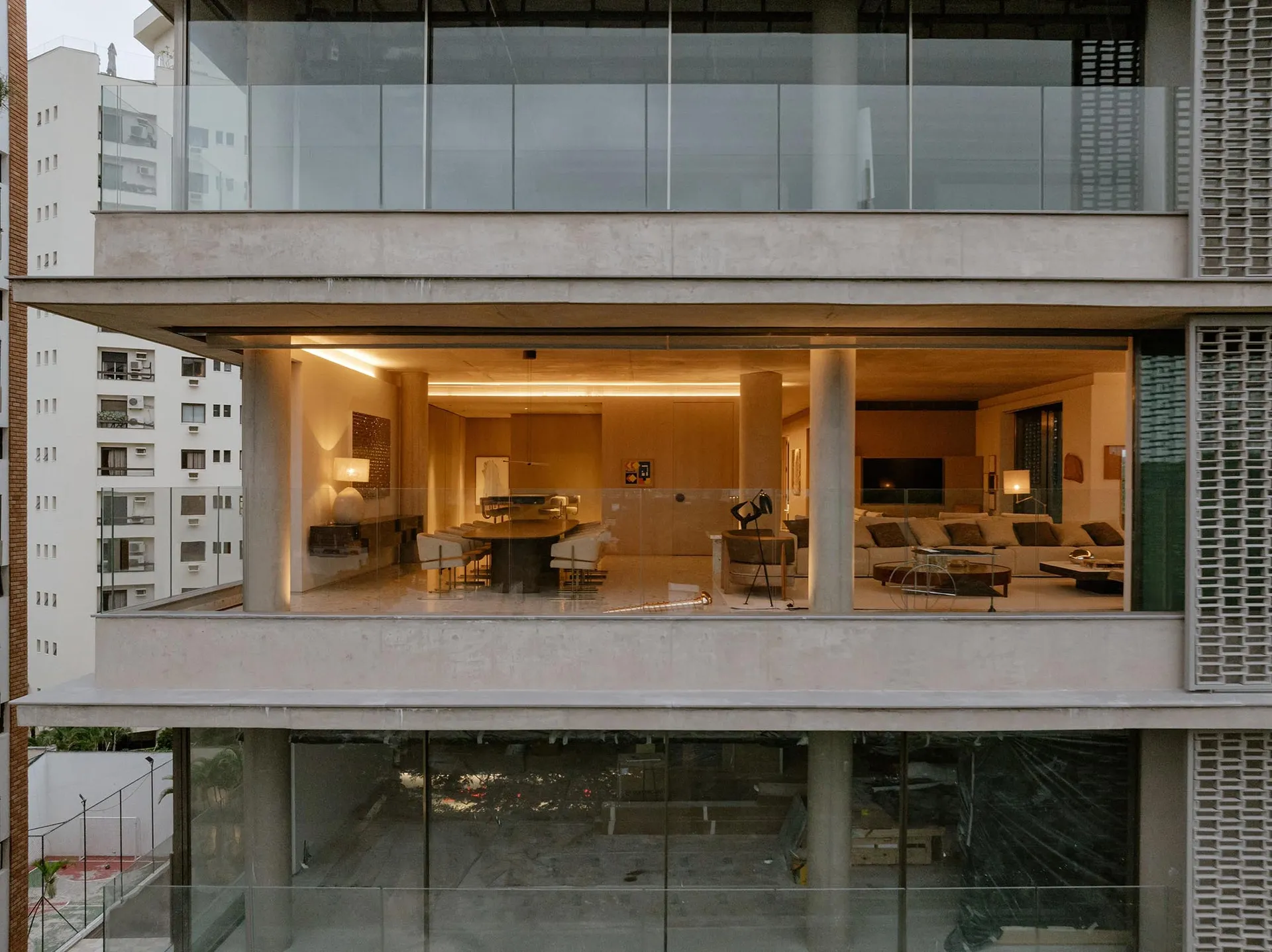 Modern living room with concrete walls and furniture.