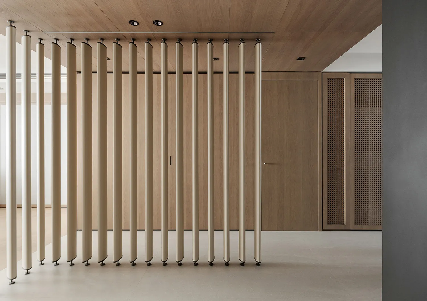 Modern minimalist interior design featuring a metal divider.