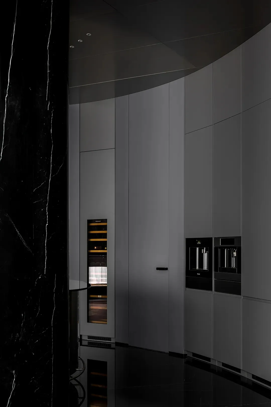 Modern kitchen with marble countertops and cabinets