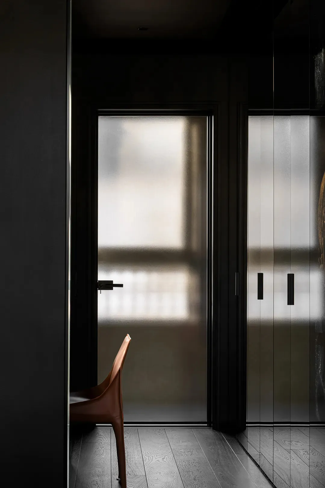 Modern minimalist interior design featuring frosted glass doors.