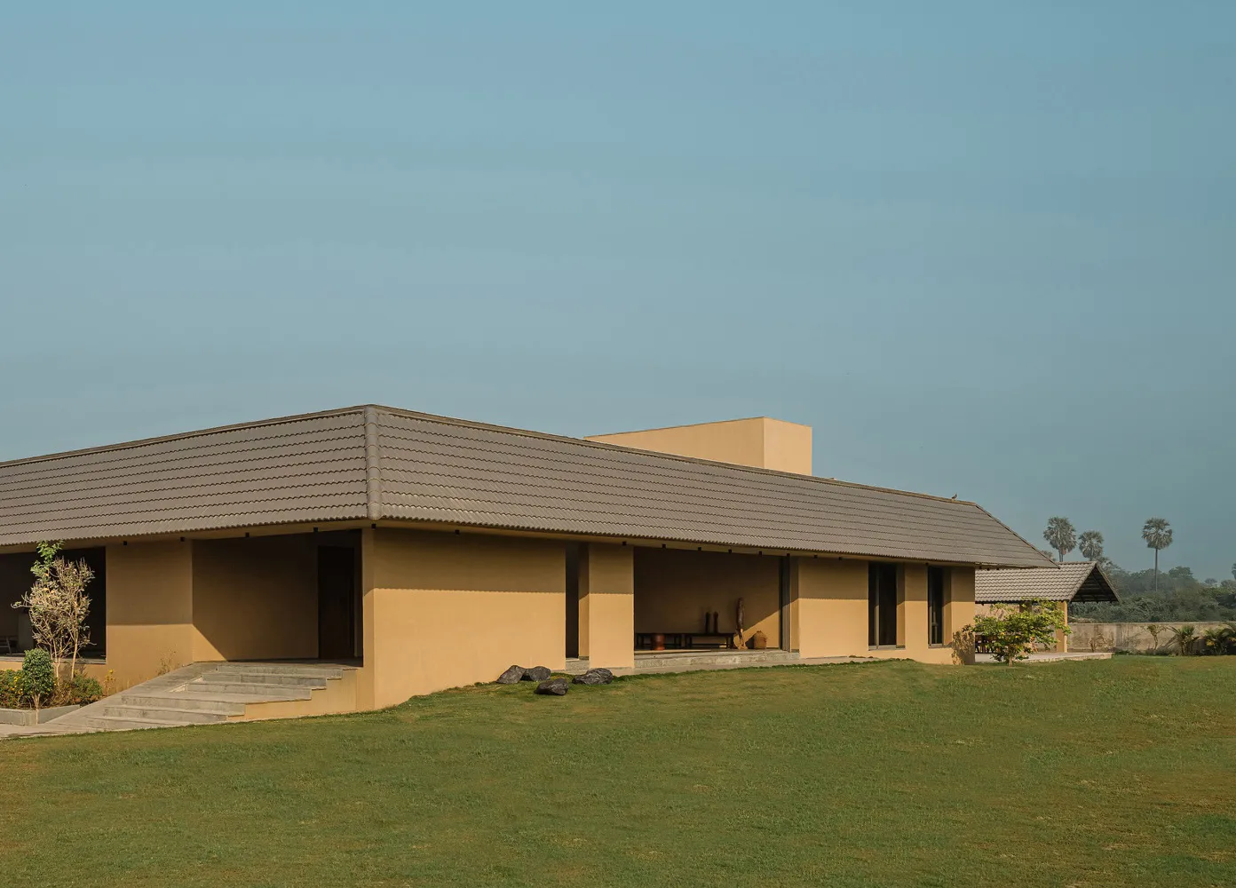 Modern residential building with concrete facade and roof