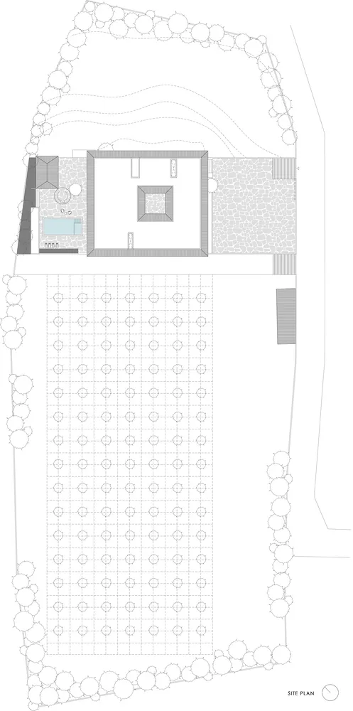 2D architectural drawing of a building site with lines, shapes, and annotations indicating different areas and elements.