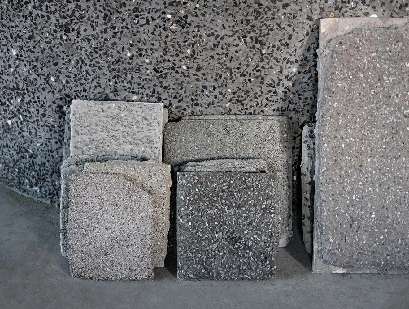 Concrete material samples with industrial texture and finish.