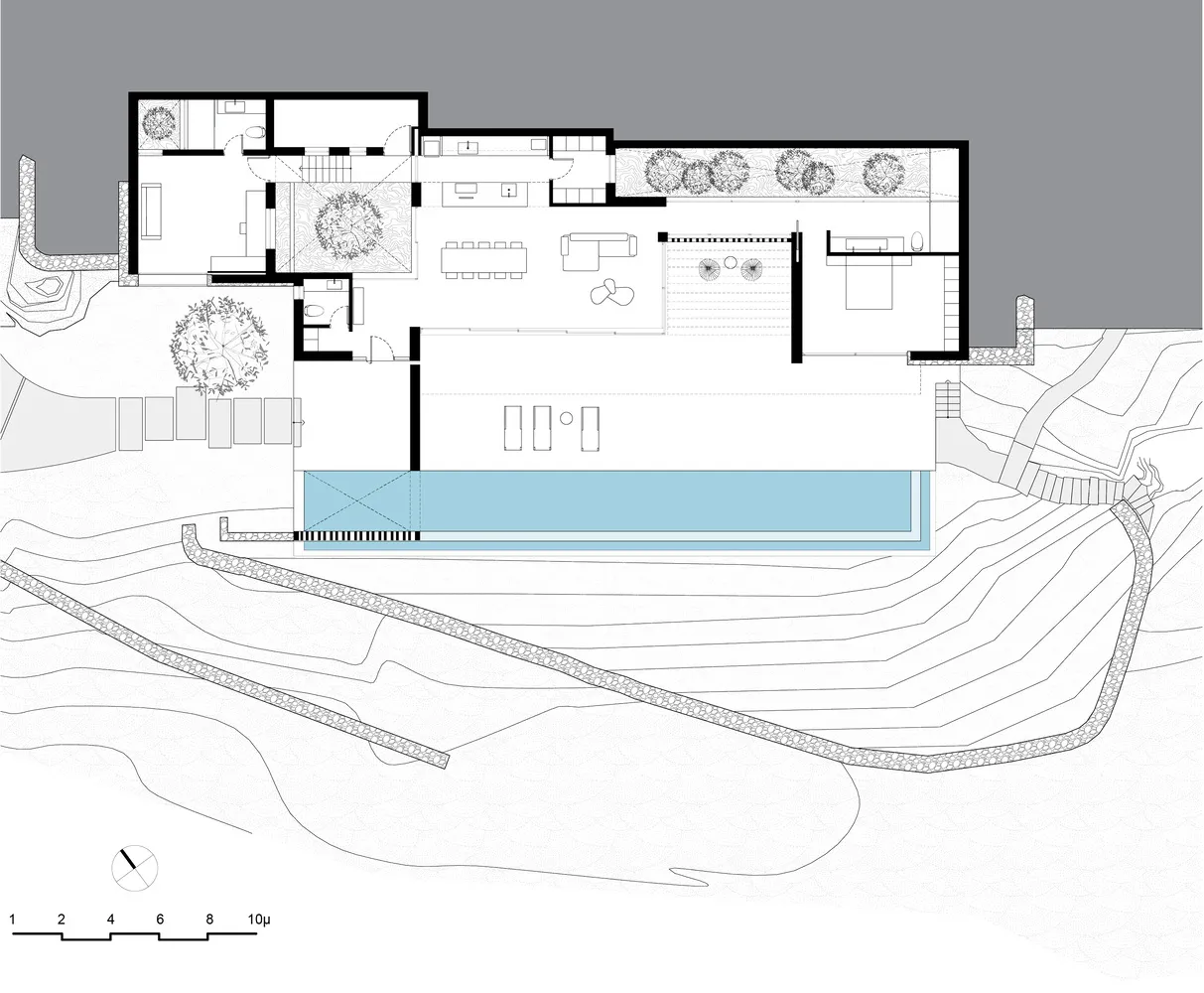 A floor plan of a modern house with glass elements.