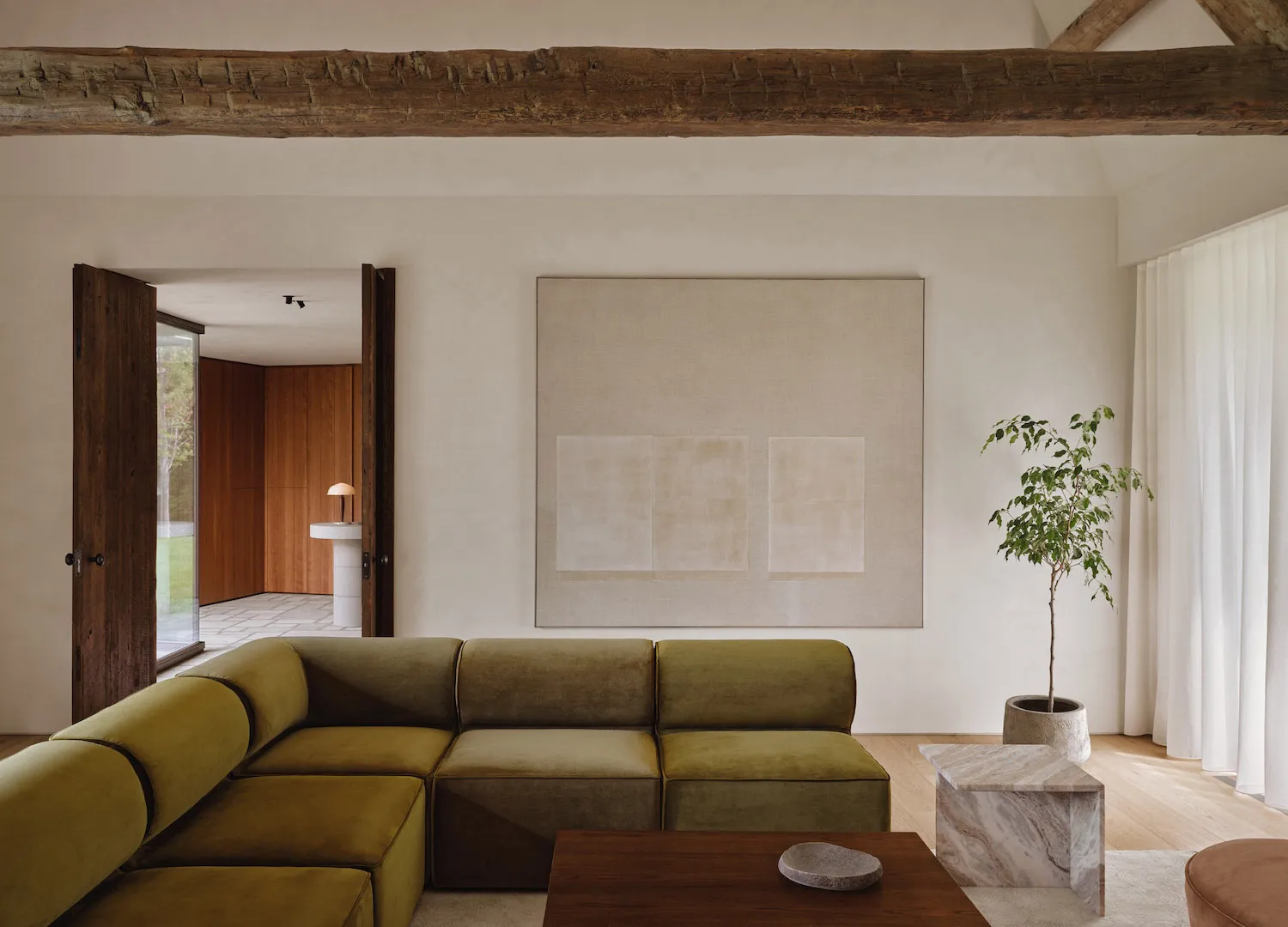 Modern living room featuring a neutral-toned color palette and minimalist design.