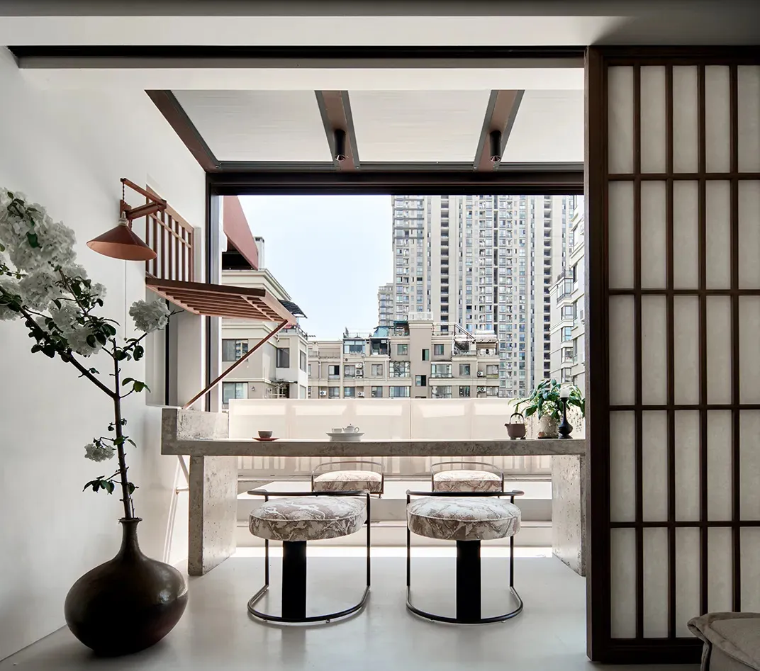 A modern minimalist interior with concrete and marble materials