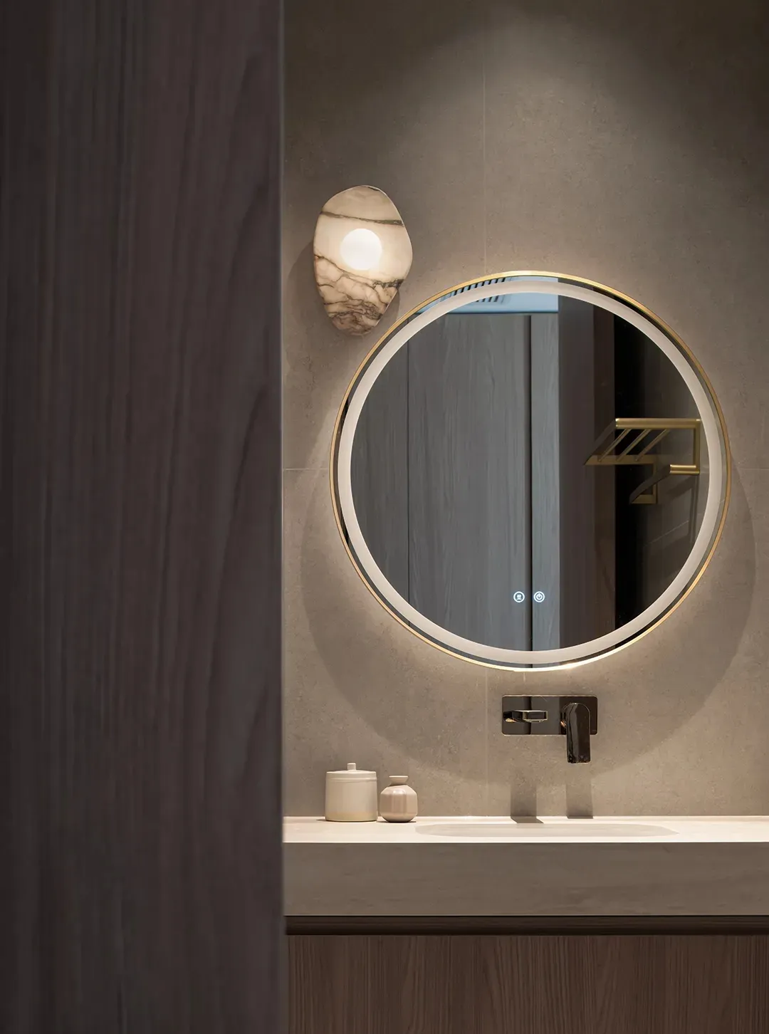 A modern bathroom featuring a wall-mounted ceramic sink with a sleek, minimalist design.