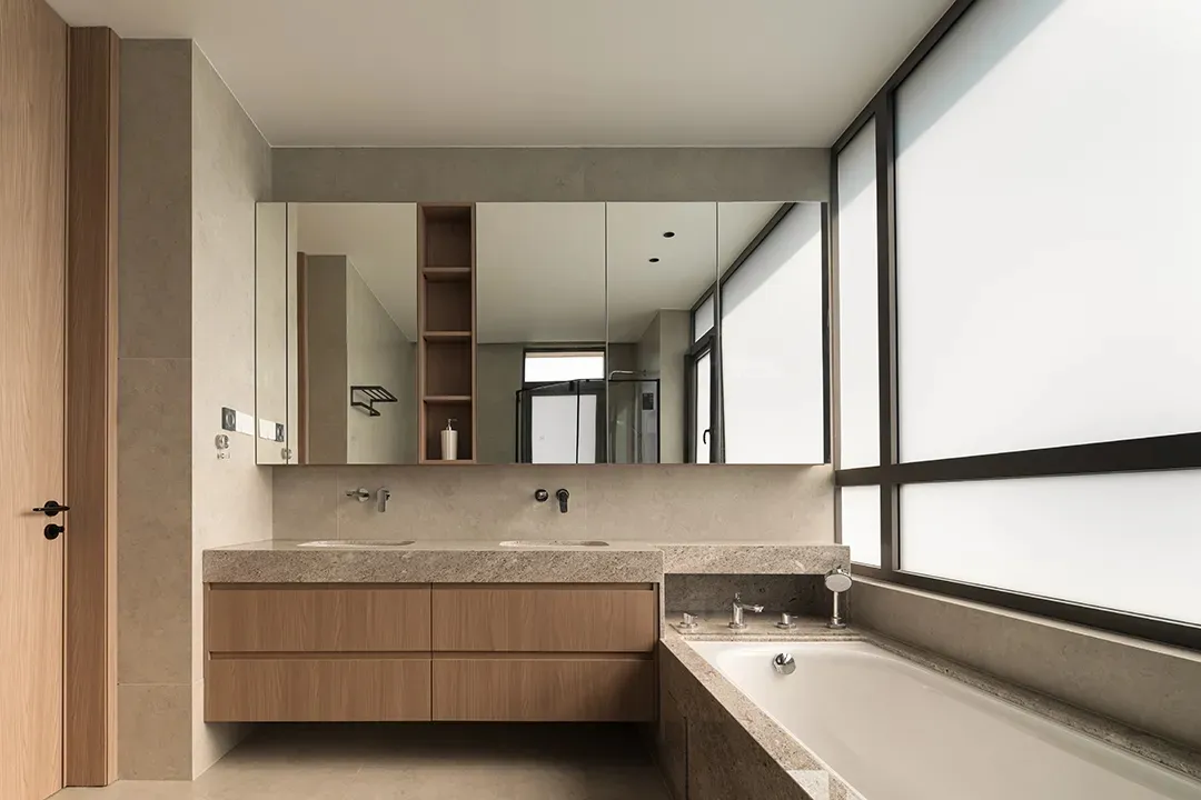 Modern bathroom with granite countertop and large window